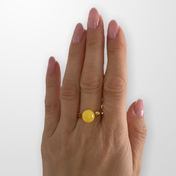 Yellow amber ring in the shape of an ideal ball