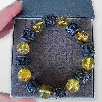 Men's bracelet made of black oak and clear amber balls