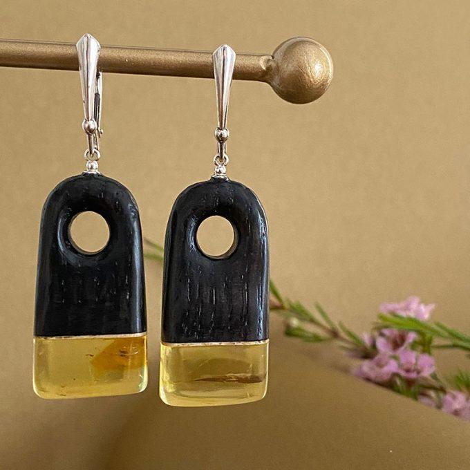 Black oak and clear amber combination earrings with abstract hole shape