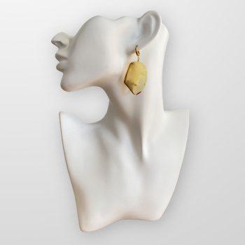 Cut yellow amber earrings in abstract shapes