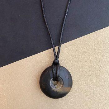 Expressive black amber men's amulet