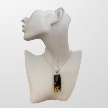 Massive polished rectangular amber neck pendant in clear to cherry colour