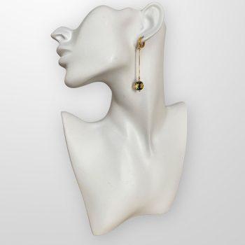 Chic green faceted amber earrings with a spherical shape