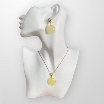 Stylish set of polished circle-shaped yellow amber earrings and necklace pendant