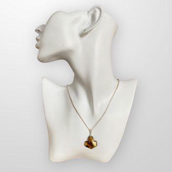 Stylish Viking symbolism speckled clear amber necklace