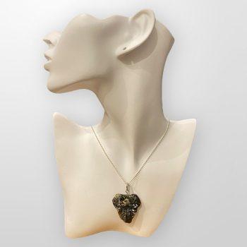 Expressive and characterful amber pendant and ring set with abstract shapes