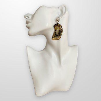 Expressive and ornate amber earrings in abstract shapes