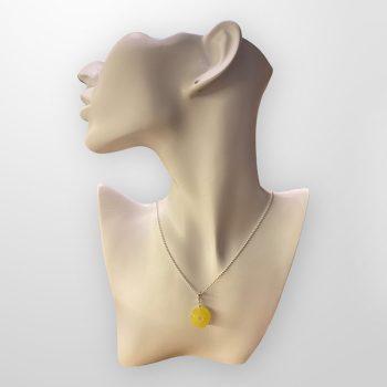 Stylish round amber amulet