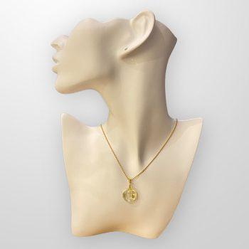 Stylish round transparent amber amulet