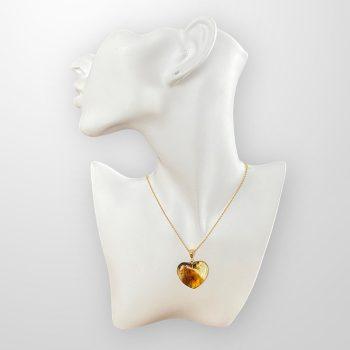 Stylish and youthful clear amber heart necklace decorated with organic patterns