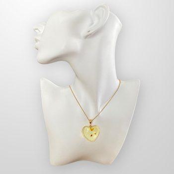 Stylish and youthful clear amber heart necklace with natural dots