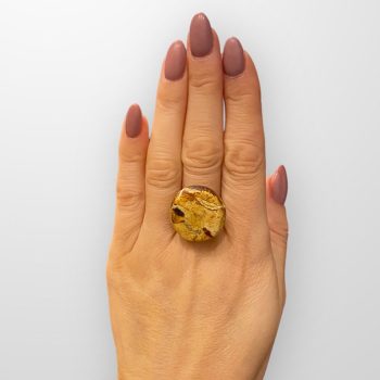 A distinctive matt amber ring with a flat shape resembling the relief of Mars