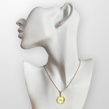 Charming transparent amber amulet with strands