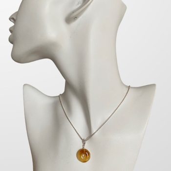 Fine caramel amber amulet
