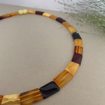 Expressive multicoloured amber necklace-collar with Egyptian motifs