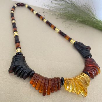Expressive multicoloured amber necklace with Aztec motifs