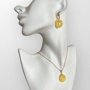Stylish amulet-shaped yellow amber necklace and earrings set