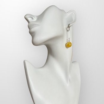 Delicate yellowish amber earrings in the shape of dangling bubbles
