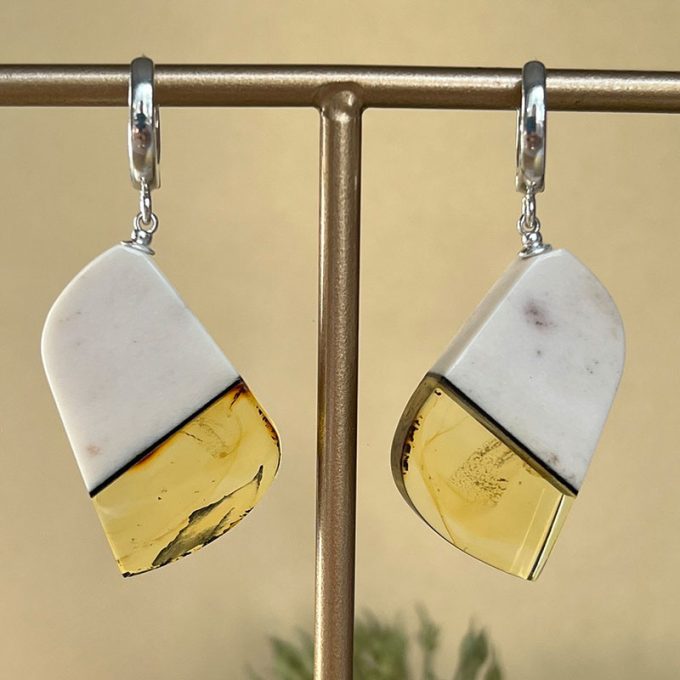 Elegant abstract shaped earrings in biredium horn and clear amber
