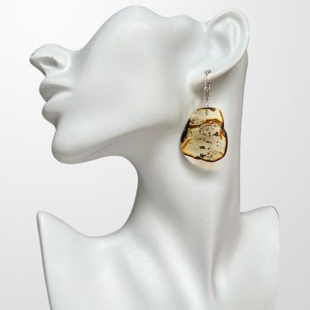 Expressive abstract shape clear amber earrings with dark spots