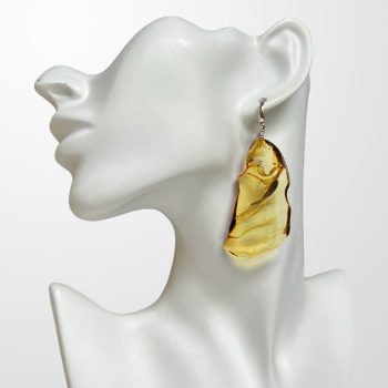 Expressive amber earrings in abstract shapes in yellow with dark threads