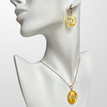 Fine set of clear amber earrings and pendant in the shape of an amulet