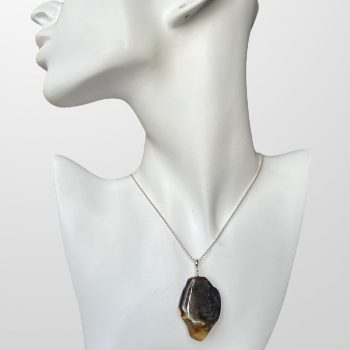 Dark yellow amber neck pendant with abstract shape