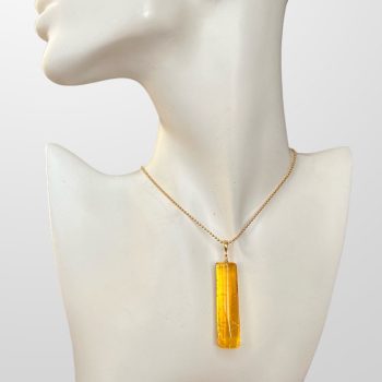 Elegant clear amber necklace in the shape of a stick