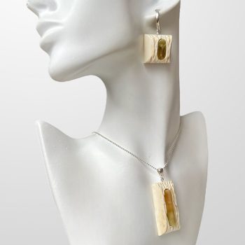 Elegant moose horn and amber pendant and earrings set with expressive shapes
