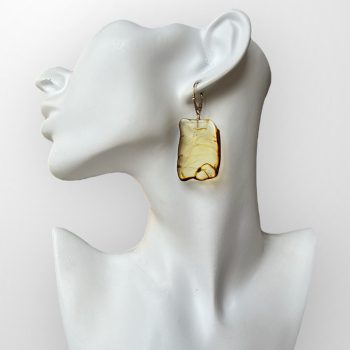 Elegant yellow cut amber earrings with waves