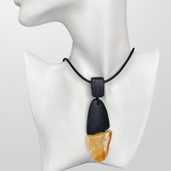 Expressive landscape amber neck pendant with black oak details