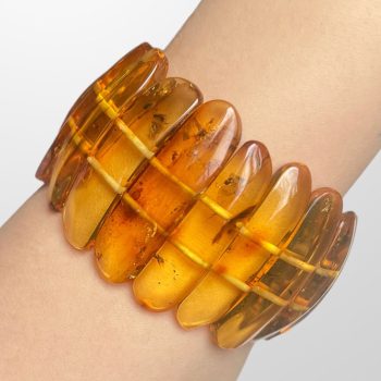 Stylish clear amber bracelet with inlays