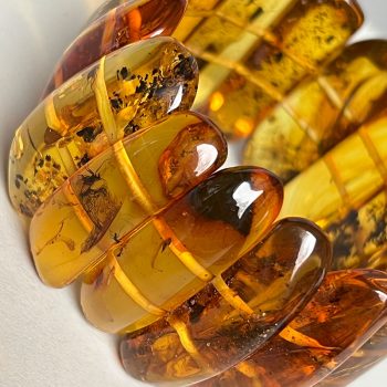 Delicate clear amber bracelet with inlays