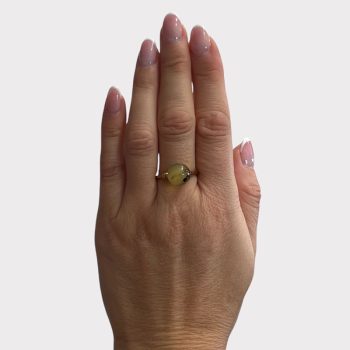 Youthful ball-shaped clear amber ring in moss amber
