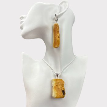 Delicate set of earrings and necklace pendant in matt yellow amber with natural bark and inclusions