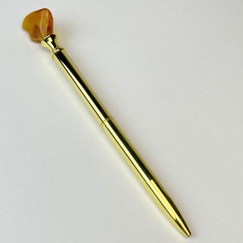 Gold pen with amber piece