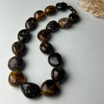 Fine necklace with dark amber stones