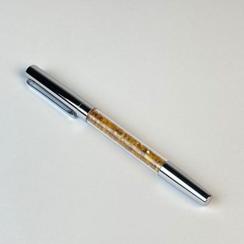 Silver pen with amber pieces
