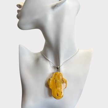 Fine polished cross-shaped landscape amber neck pendant