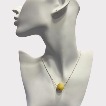 Stylish faceted yellow amber neck pendant with a diameter of 1.5 cm