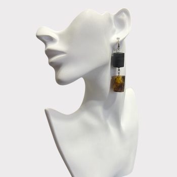 Playful cylinder earrings in black oak and speckled amber