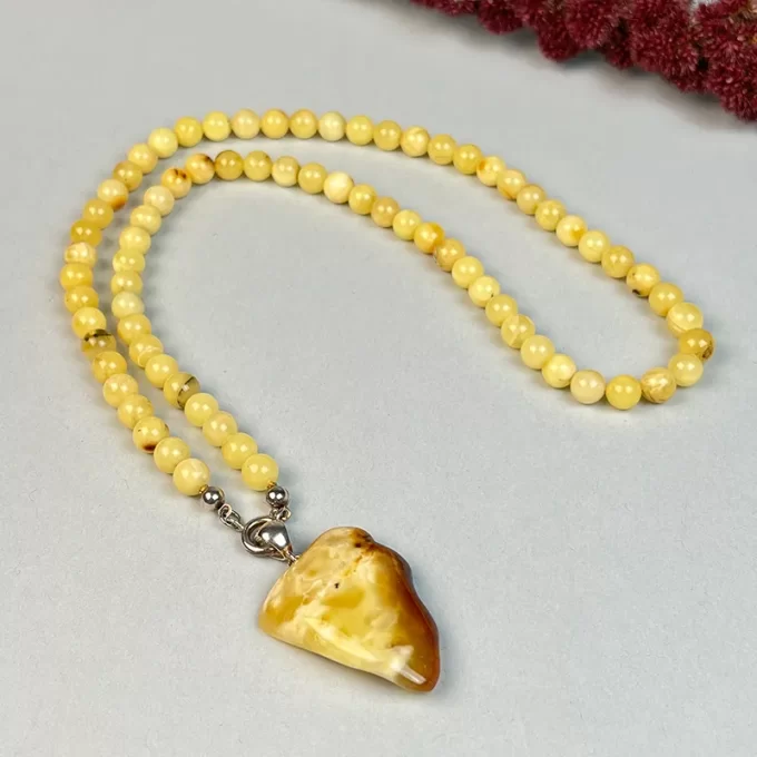 Fine yellow amber necklace with amber landscape pendant