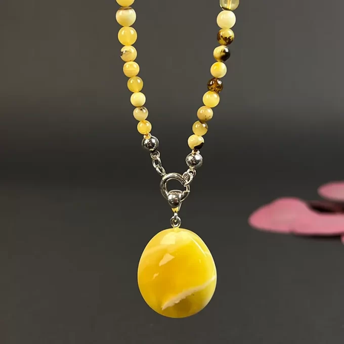 Fine speckled amber necklace with yellow landscape amber pendant