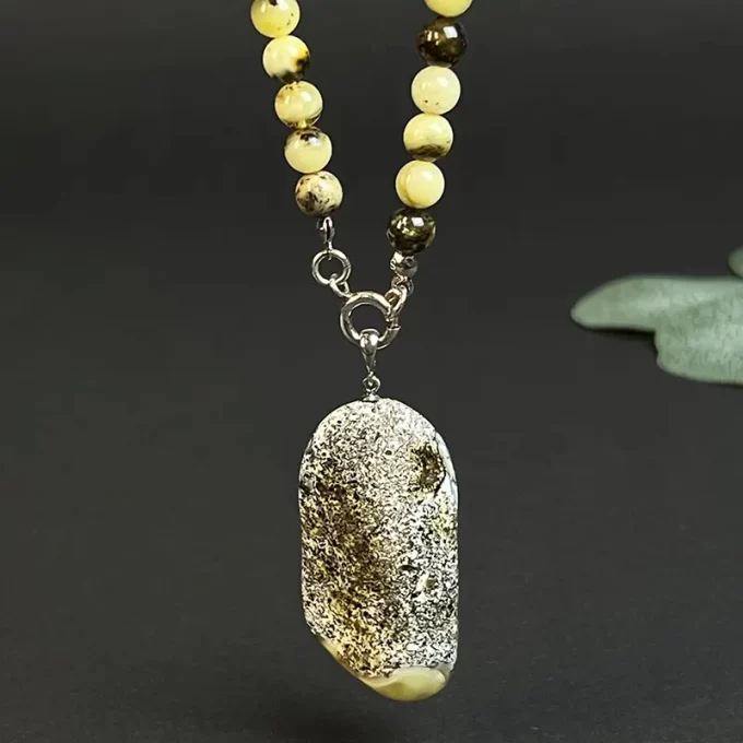 Fine speckled amber necklace with landscape amber pendant
