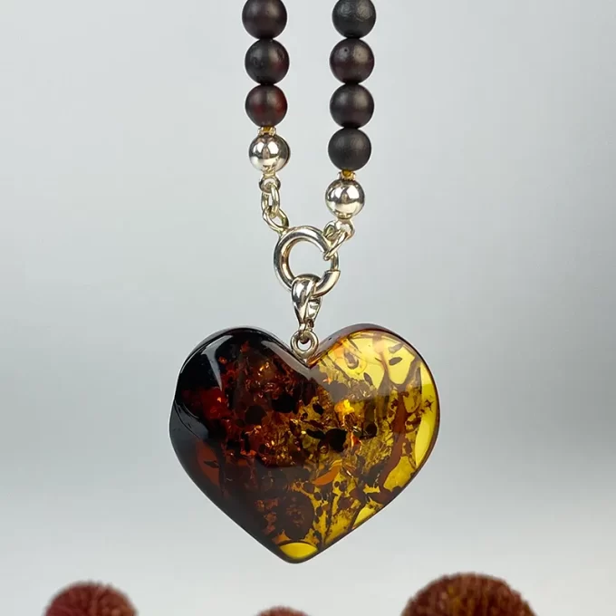 Fine necklace in dark matt amber with heart pendant
