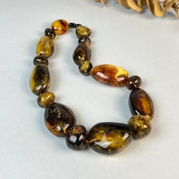 Spectacular massive amber pebble necklace with moss