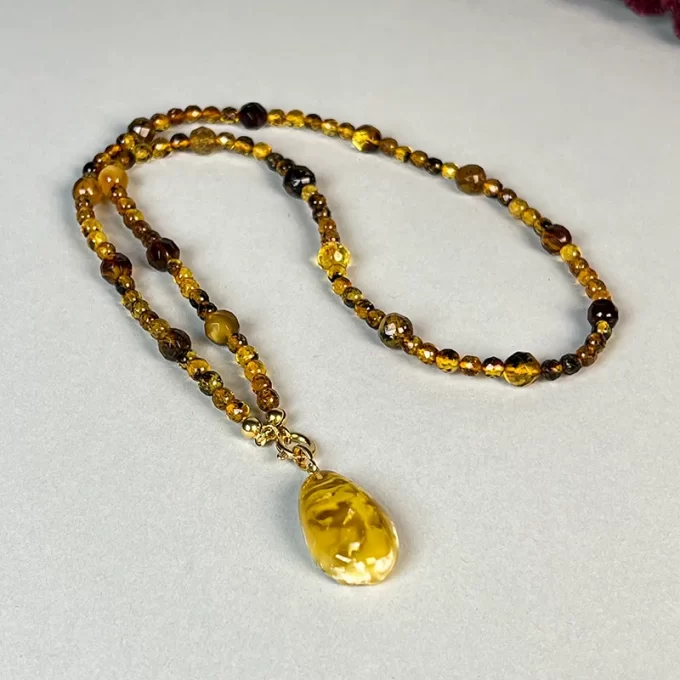 Enchanting clear faceted amber necklace with amber landscape pendant