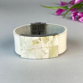 Trendy white leather bracelet with white landscape amber detail