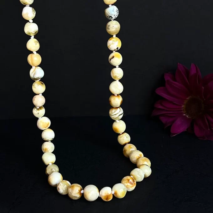 Stunning necklace of shiny landscape amber beads