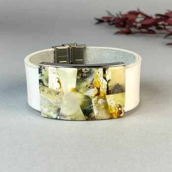 Stylish white leather bracelet with landscape amber detail